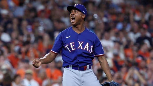Texas Rangers relief pitcher Jose Leclerc reacts after striking out Houston Astros pinch-hitter Jon Singleton to end the eighth inning during Game 6 of the ALCS Sunday night at Minute Maid Park.
